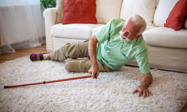 senior man on the floor of his living room having just experienced a fall